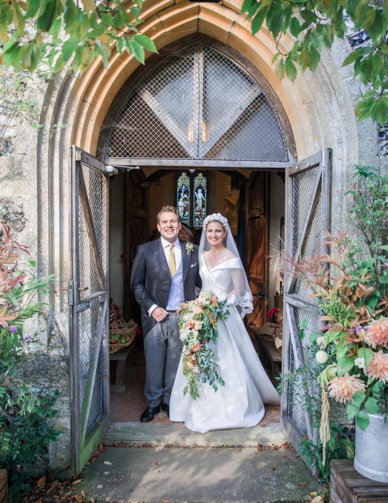 bride and groom in bespoke morning suit on wedding day