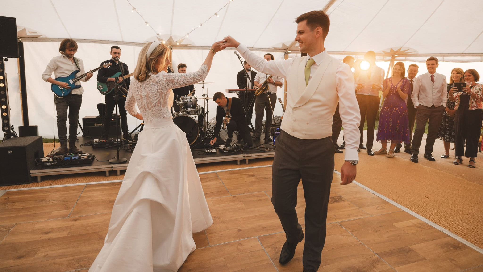 bride and groom dancing in a marquee on their wedding day