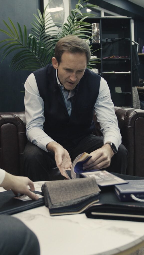 Your Bespoke Journey Starts here.Client selecting his Bespoke Blazer