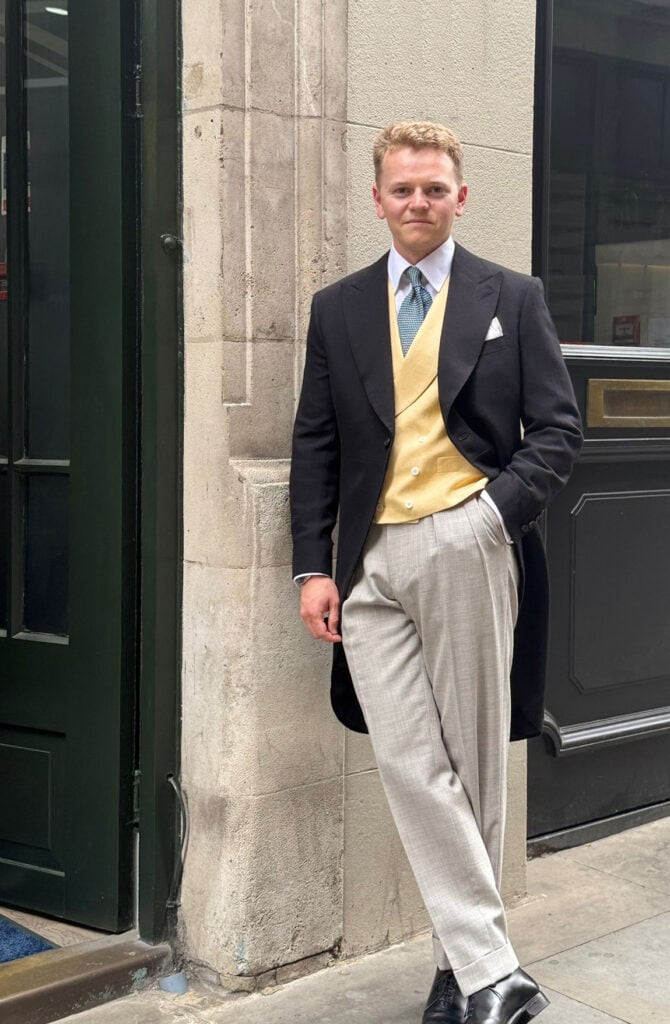 man stands in bespoke morning suit