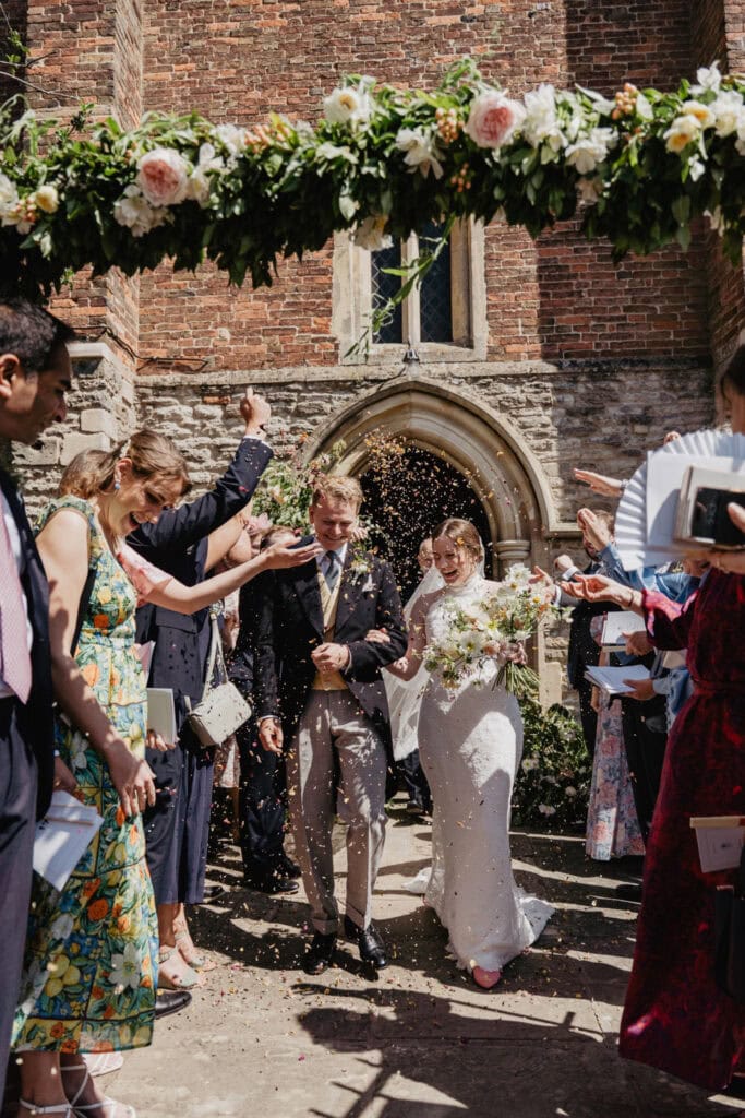 wedding day with groom in bespoke morning suit with yellow waistcoat